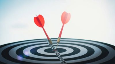 business targeting and winning goals business concepts. dart arrow hitting in the target center of dartboard. Profit and business growth. Strategy concept.